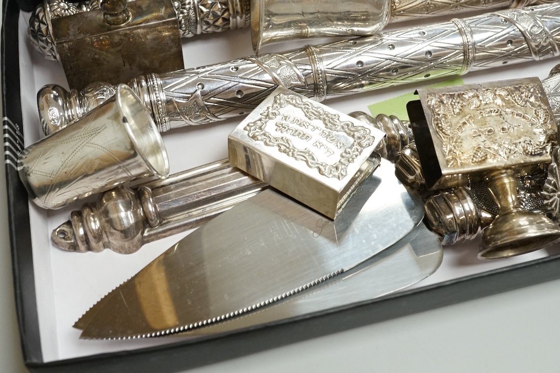 A small group of assorted continental 925 and other white metal items including a Judaic scroll holder, a Torah pointer?(lacking pointer), an Israeli ashtray, three Judaic match sleeves, two 925 handled servers and an Ir